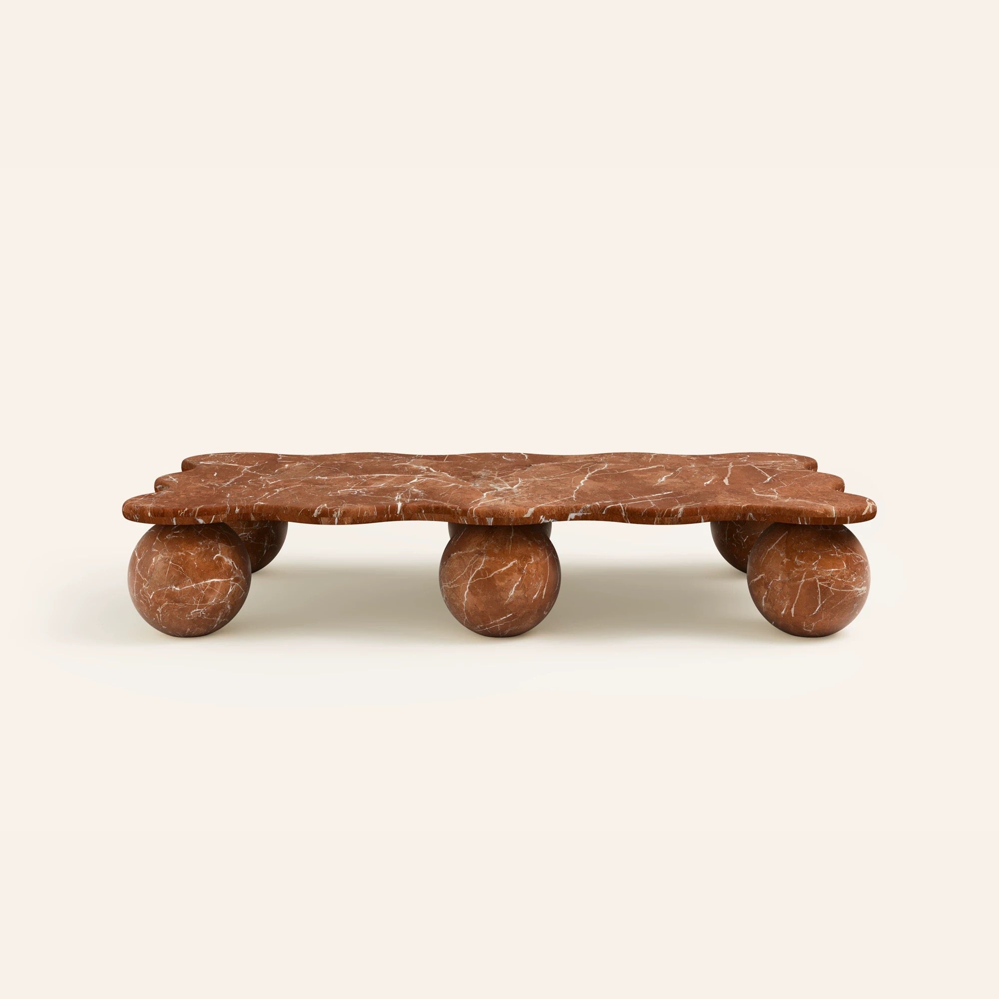 Sculptural rectangular marble coffee table with spherical stone legs